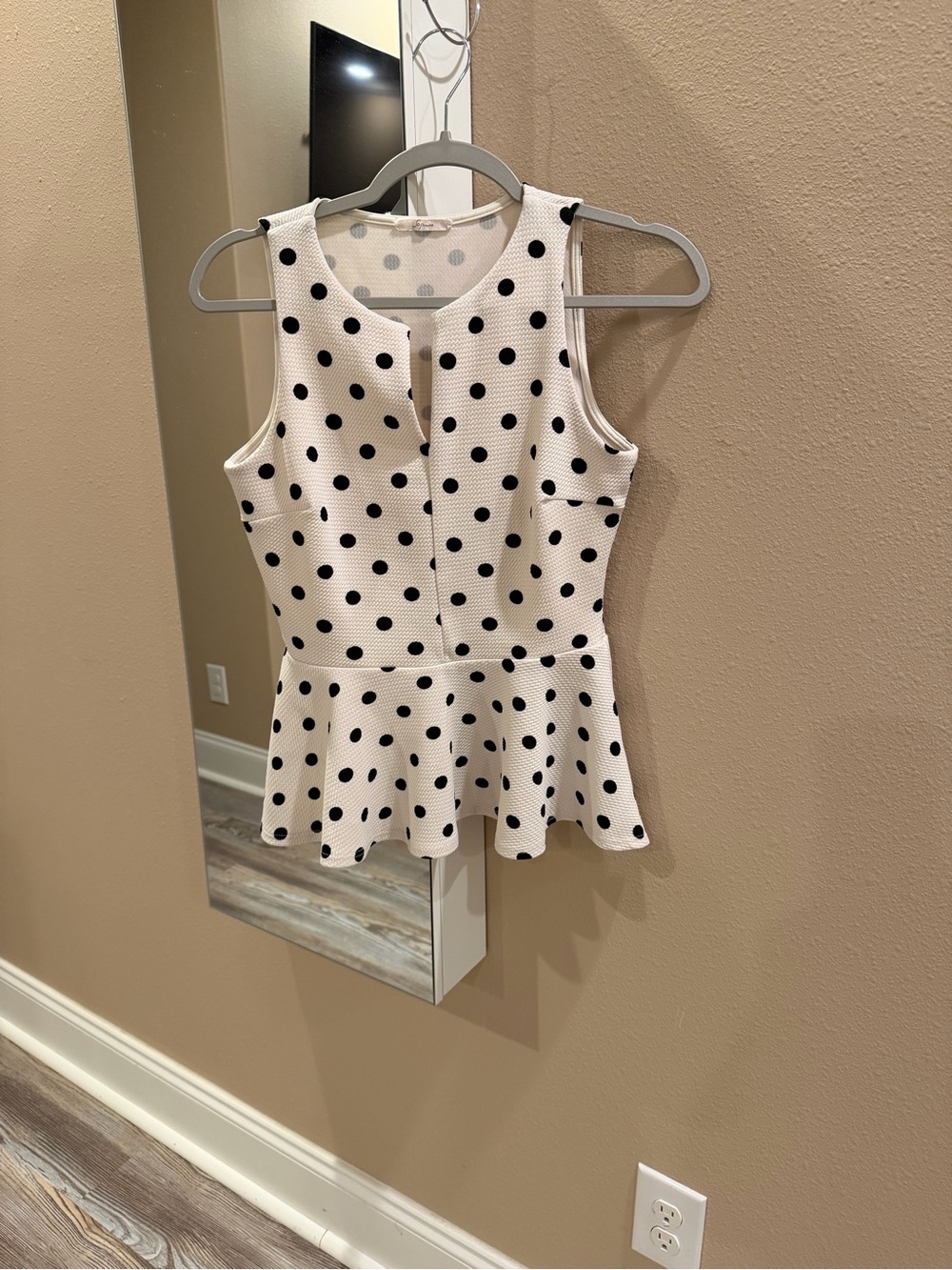 Soprano White Sleeveless Peplum Top with Black Polka Dots